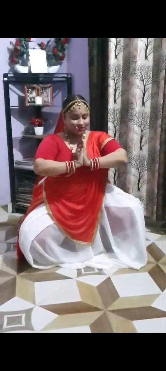 Dancer demonstrating a seated pose during practice