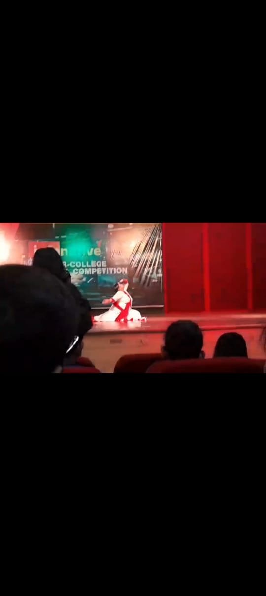Dance performance on an illuminated stage