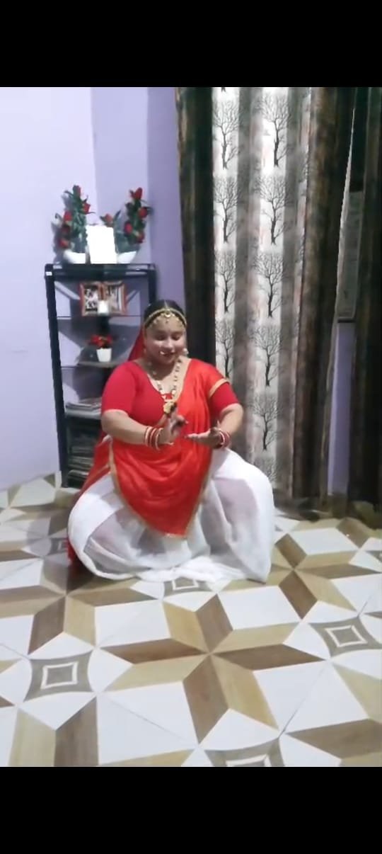 Dancer practicing a seated gesture