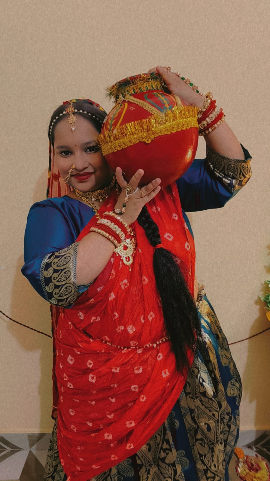 Performer posing with a decorated prop