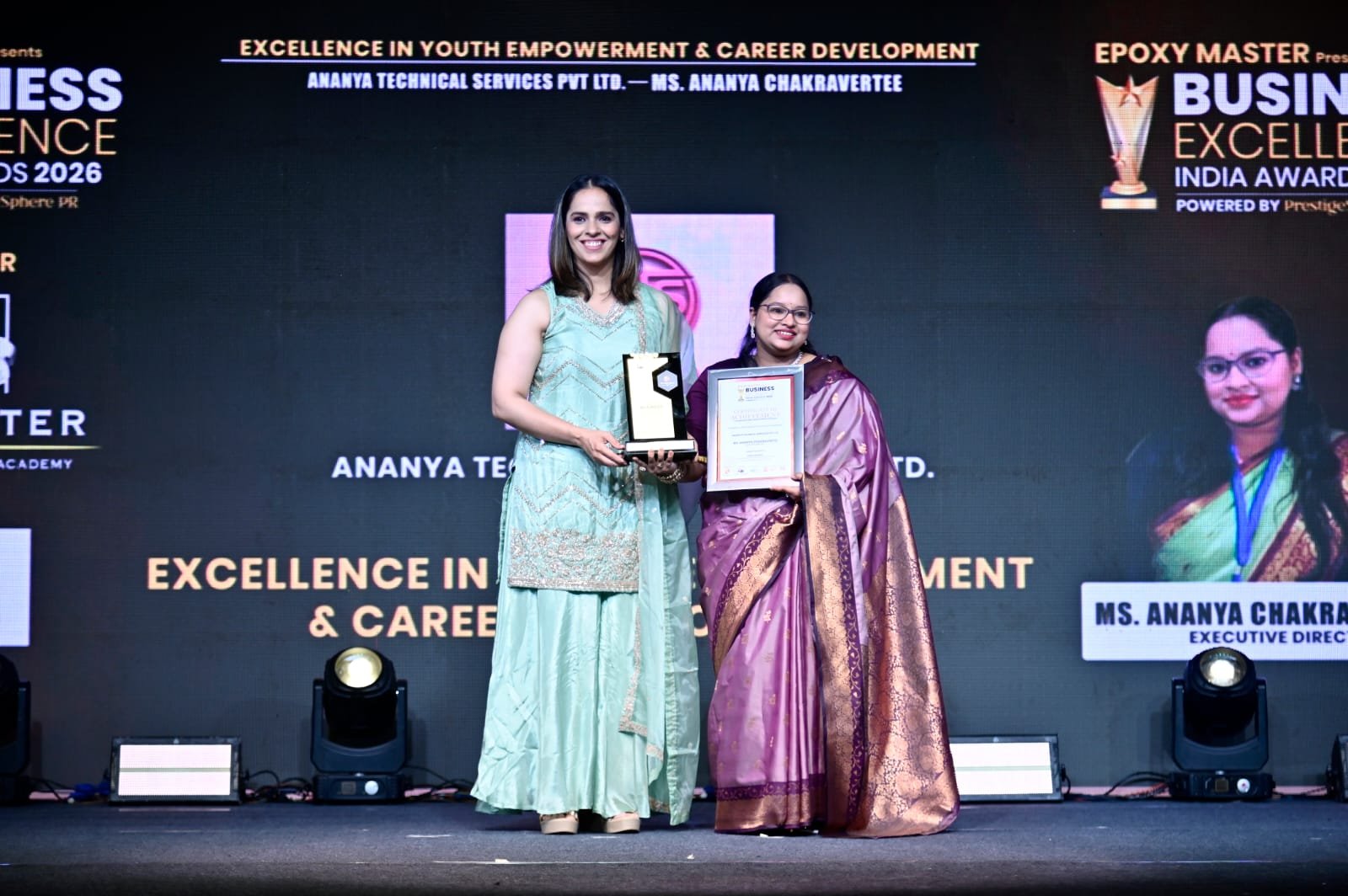 Award recipients posing together on stage